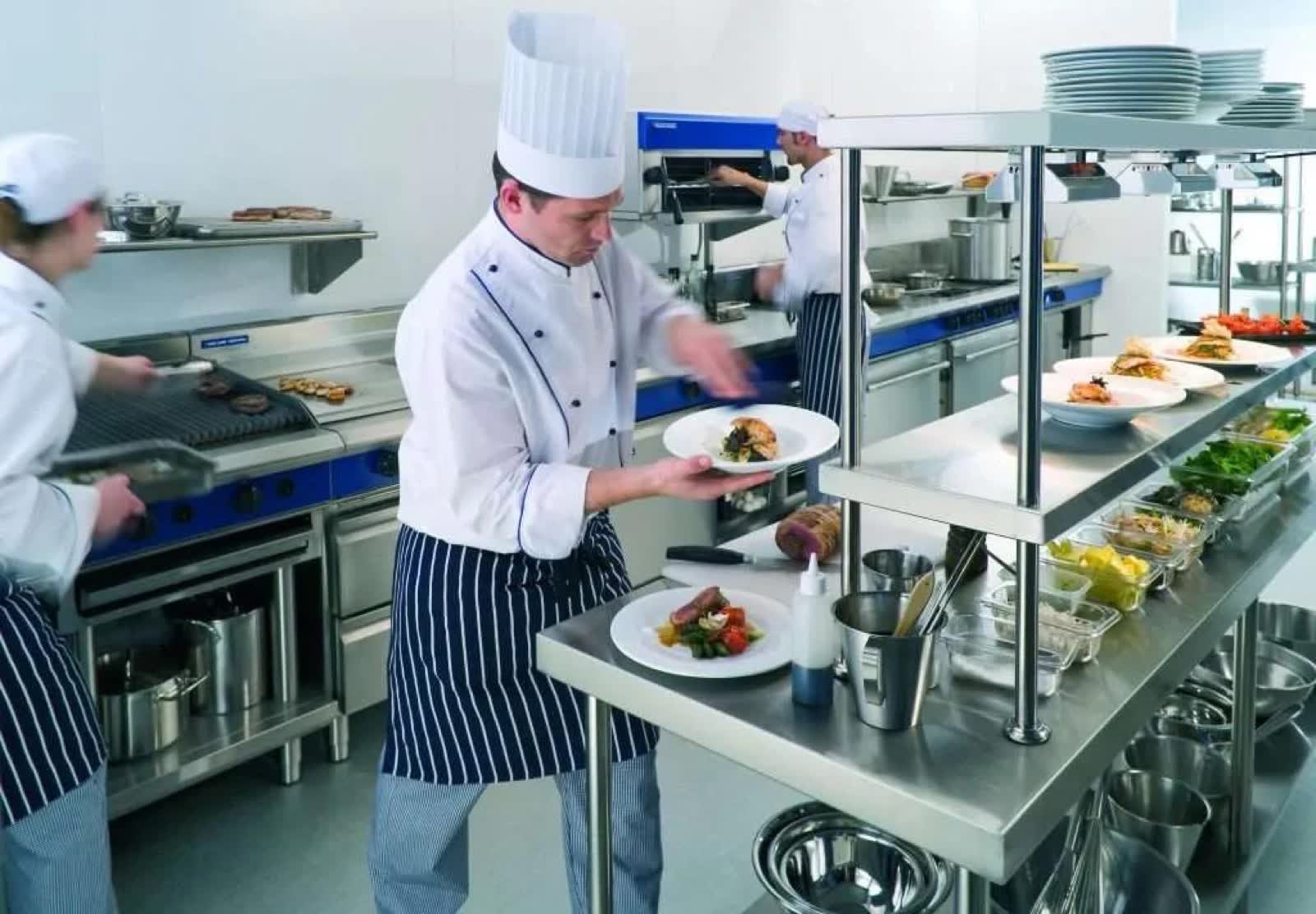 Chefs working a commercial kitchen line